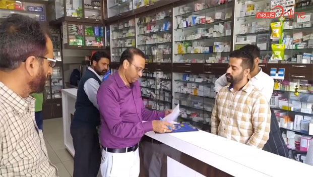 health department team checked prices and records of masks and sanitizers at chemist shop