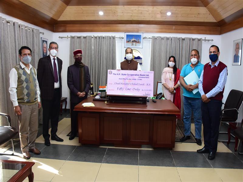 Chief Minister Jai Ram Thakur was presented cheques of Rs.50 lakh towards Chief Minister Relief Fund and Rs. 29,21,271 towards Chief Minister Covid-19